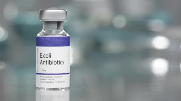 E.coli antibiotics vial in medial lab slowly rotating on left side. - Metraje, vídeo