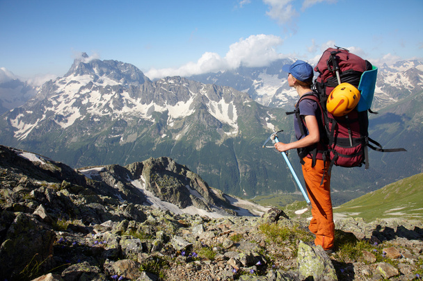 Hiker girl with backpack and ice-axe - Fotoğraf, Görsel
