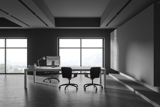 Εσωτερικό σύγχρονο γραφείο CEO με γκρι τοίχους, τσιμεντένιο δάπεδο, άνετο τραπέζι υπολογιστή με καρέκλες για τους επισκέπτες. Παράθυρο με θολή θέα στο βουνό Έννοια της διαχείρισης. 3d απόδοση - Φωτογραφία, εικόνα