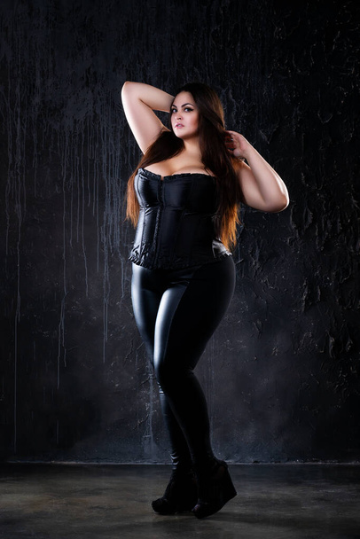 Plus size model in sexy clothes, fat woman on dark background, overweight female body, full length portrait - Fotoğraf, Görsel