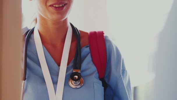 Female care worker on home visit, close up - Video, Çekim