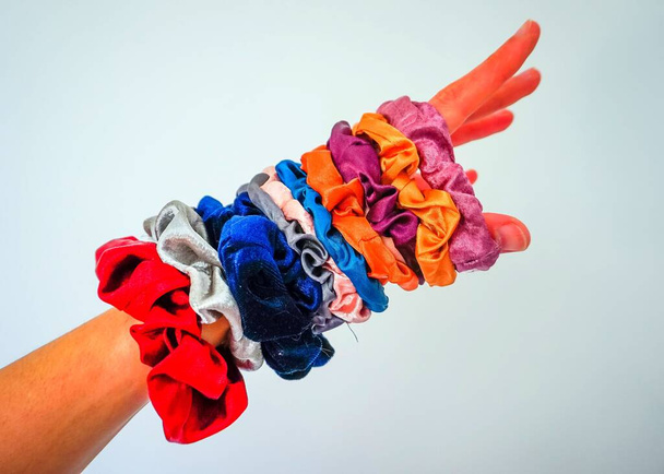 silky and velvety colorful scrunchies and hairbands for modern and stylish hairstyles to do at home - Photo, Image