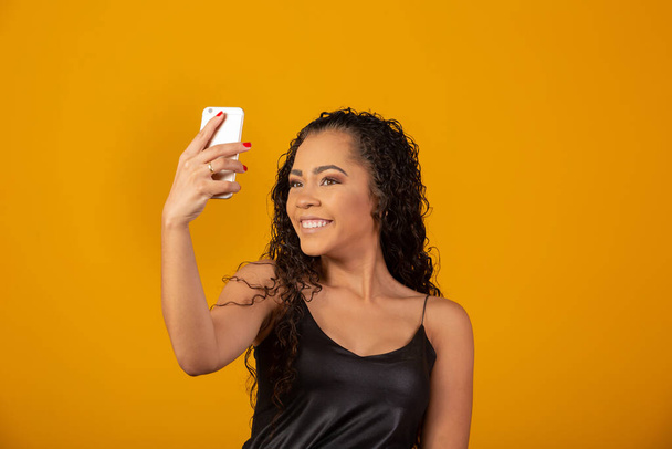 Self portrait of beautiful young afro american woman. Selfie concept - Fotografie, Obrázek