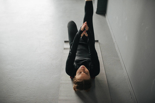 Caucasian female sportswoman stretching muscles in workout in pilates studio. Set photo with film photo gain. - Fotoğraf, Görsel