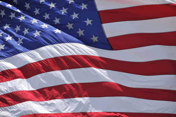 Hermosa bandera americana ondeada con luz solar de marco completo, ideal para fondos patrióticos, diapositivas y presentaciones
 - Foto, imagen