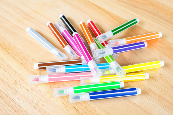 Felt-tip pens on wooden background. - Photo, Image
