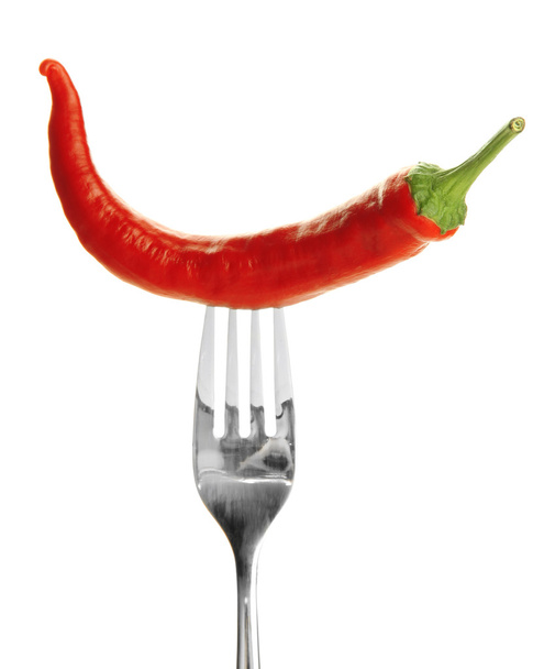 Red hot chili pepper on fork, isolated on white - Foto, Imagen