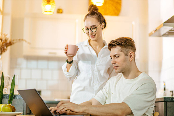 young caucasian couple want to buy their first property online - Fotografie, Obrázek