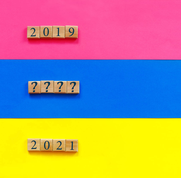 Blue, pink, yellow paper background with conceptual text: "2020"  for design.  Flat lay, top view, copy space concept. - Fotó, kép