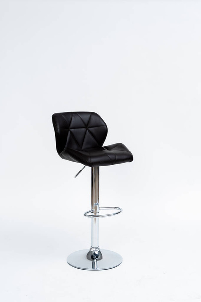 chrome-plated bar stool with black padded seat on with background - Fotografie, Obrázek