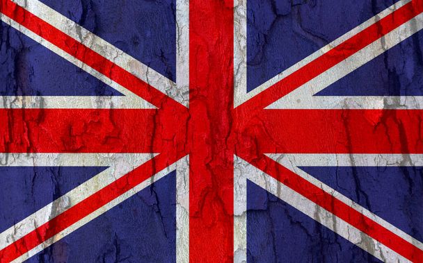 UK flag on bark texture background. Background for greeting cards for UK public holidays. Day of Remembrance and Reconciliation. May holiday. Spring day off. Queen's birthday. - Photo, Image