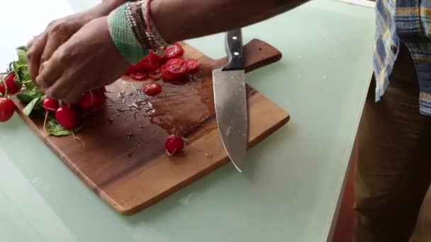 Close up chef preparing organic cherry tomatoes at home - Materiał filmowy, wideo