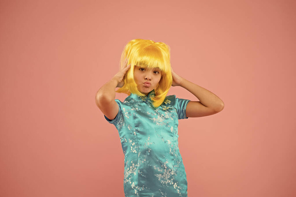 Anime fan. Child cute cosplayer. Anime emotional expression. Anime admirer. Girl yellow wig. Cosplay character concept. Japanese style. Eastern trends for teens. Hobby and entertainment. Pop culture - Fotó, kép