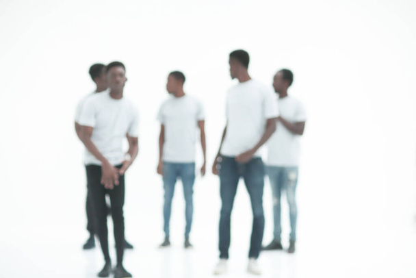 blurry image of a group of young men in white t-shirts - Foto, immagini