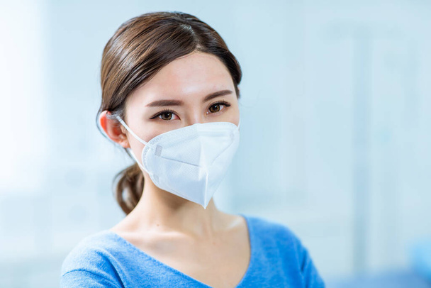 asian woman patient look to you with facial mask in hospital - Photo, image
