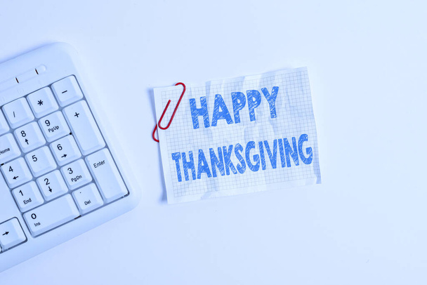 Writing note showing Happy Thanksgiving. Business photo showcasing Harvest Festival National holiday celebrated in November White pc keyboard with empty note paper above white background. - Photo, Image