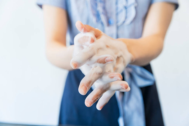 Close-up photo of washing hands carefully with a sufficient amount of hand soap - Fotó, kép