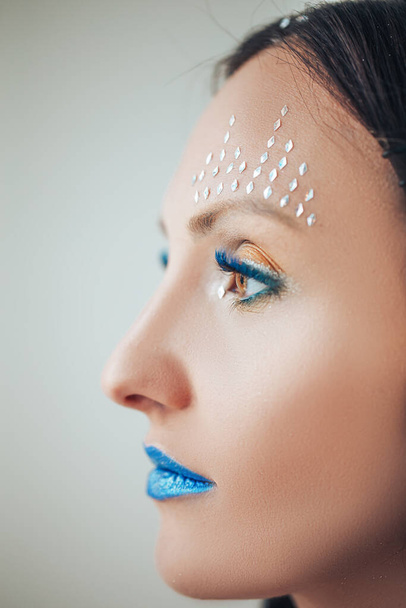 Makeup, unusual makeup blue lips blue eyelashes, cosmetic - Foto, afbeelding