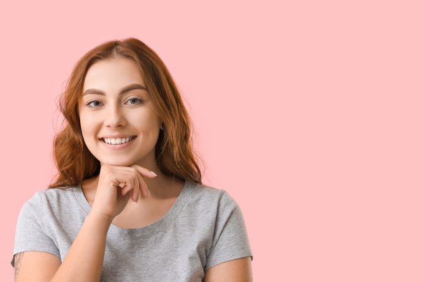 Young woman with healthy teeth on color background - Fotó, kép