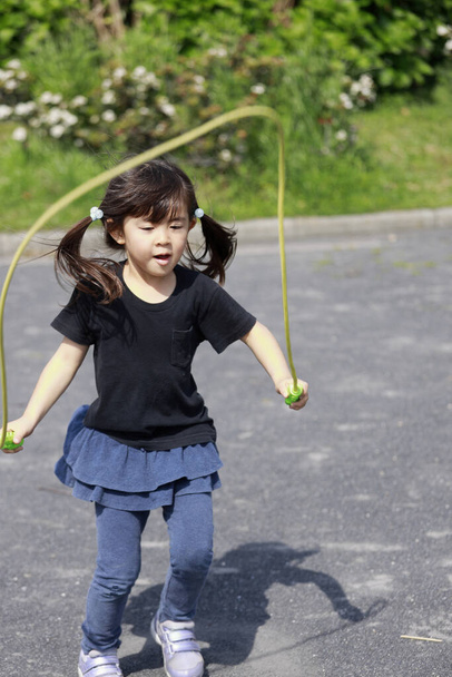 Japanese girl (5 years old) playing with jump rope - Photo, Image