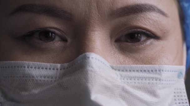 Super close up of a doctor face wearing pollution mask.  - Video