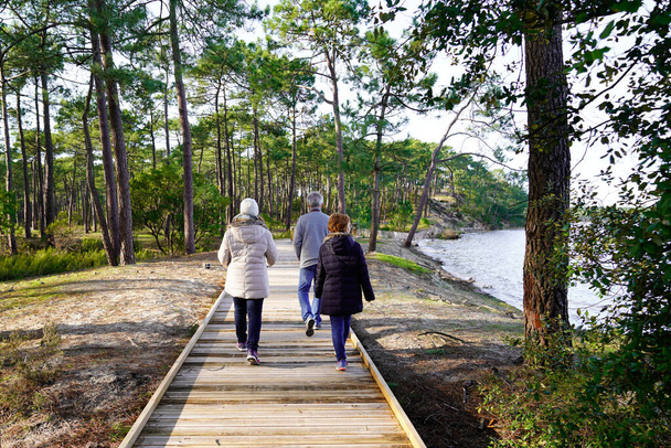 hourtin lake wooden path people walking in gironde France - Foto, immagini