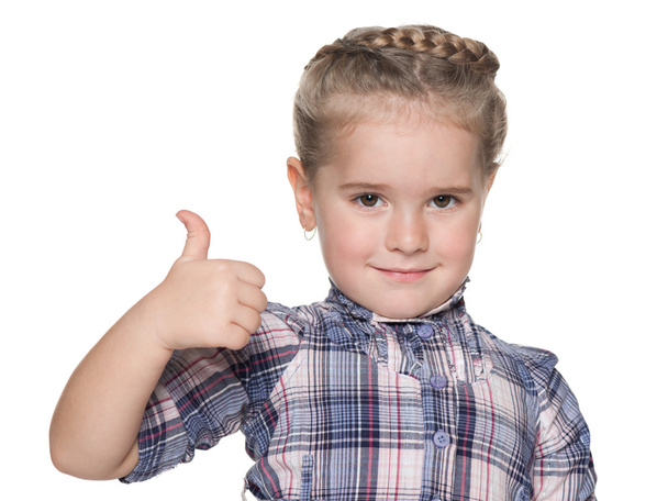 Portret van een klein meisje met haar duim omhoog - Foto, afbeelding