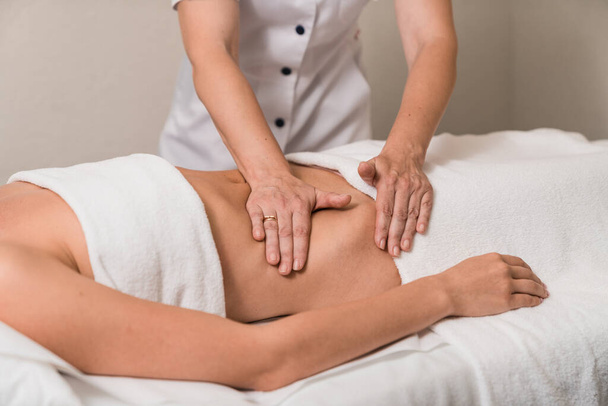 Woman having abdomen massage. - Photo, Image