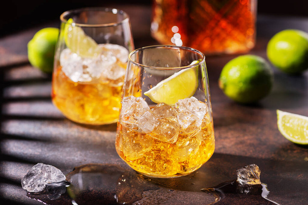 Cuban strong rum with ice and lime, summer concept with a strong shadows, selective focus image - Φωτογραφία, εικόνα