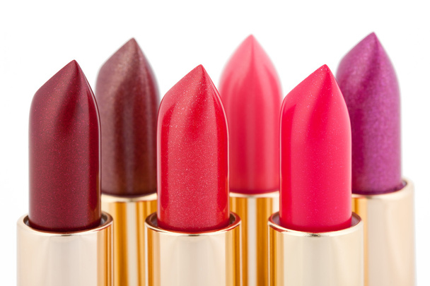 Multicolored color lipsticks arranged in two lines - Photo, image