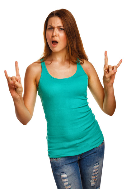 Woman shows sign devil rock metal girl in jeans - Φωτογραφία, εικόνα