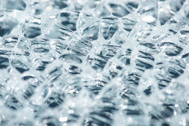 close up view of abstract transparent ice textured background - Foto, Bild