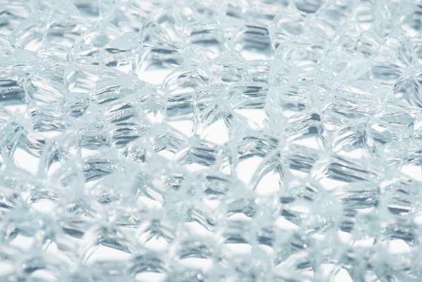 close up view of abstract transparent ice textured background - Fotó, kép