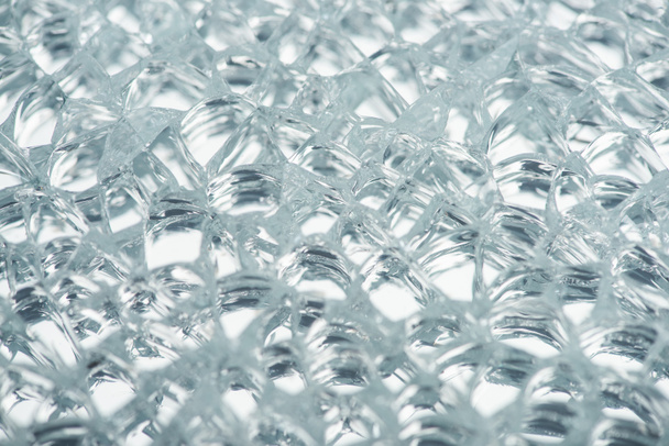 close up view of abstract transparent ice textured background - Foto, afbeelding