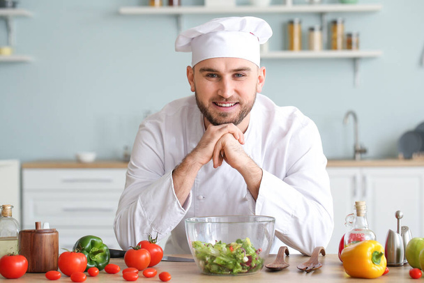 Handsome male chef in kitchen - Photo, Image