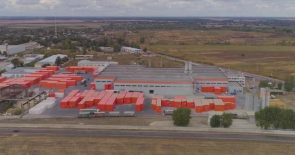 Modern factory in gray-orange colors from the air. Bright modern factory - Materiał filmowy, wideo