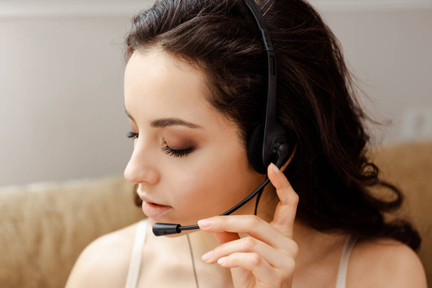 attractive girl in lingerie talking with headset - Фото, изображение