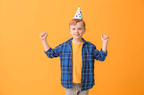 Cute little boy celebrating Birthday on color background - 写真・画像