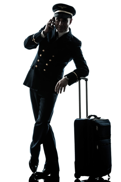 man in airline pilot uniform silhouette - Fotoğraf, Görsel