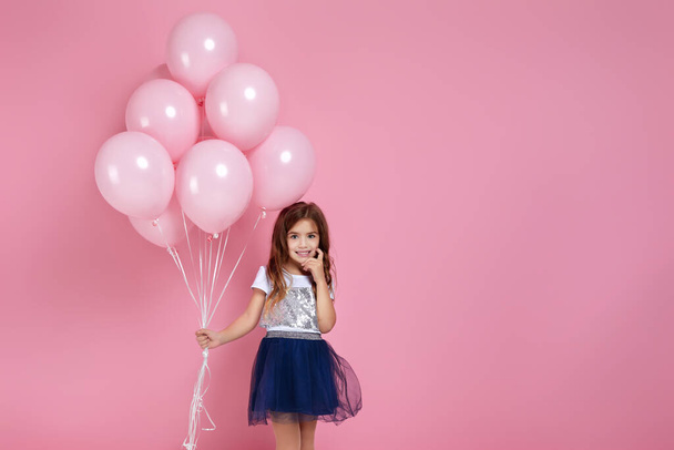 child girl posing with pastel pink air balloons - Φωτογραφία, εικόνα