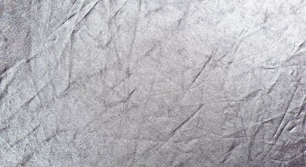 Wrinkled bright silver fabric. Texture background for design. - Foto, immagini