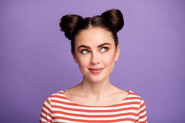 Closeup photo of pretty funny lady teen two cute buns good mood look interested up empty space dreamer wear white red casual striped shirt isolated purple pastel color background - Fotografie, Obrázek