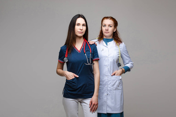 Two professional doctors with stethoscopes. together fighting against COVID-19 or coronavirus. - Photo, Image