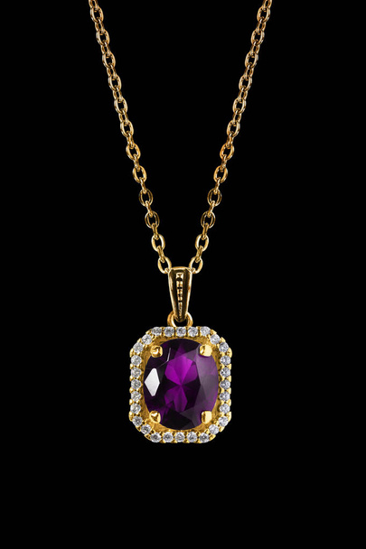 Vintage amethyst pendant with diamonds hanging on gold chain on black background - Fotoğraf, Görsel