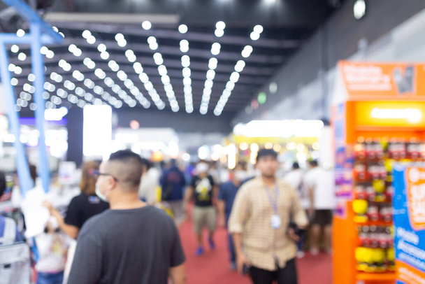 Abstract blur people in exhibition hall event trade show expo background. Business convention show, job fair, or stock market. Organization or company event, commercial trading, or shopping mall marketing advertisement concept. - Photo, Image