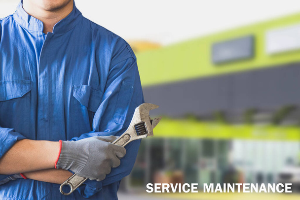 Man mechanic inspection hold wrench for fix blue car for service maintenance insurance with car engine bonnet car.for transport automobile automotive image. - Photo, Image