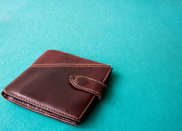 Empty wallet with no money in the background.Bankruptcy is an empty wallet.It is not possible to repay the loan and mortgage.Old and empty brown wallet - Photo, Image