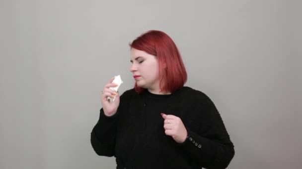 lady in black sweater sick woman with snot in a handkerchief, cold, runny nose - Video