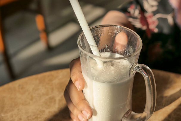 Close up of milk shake on cafe table. - Photo, Image