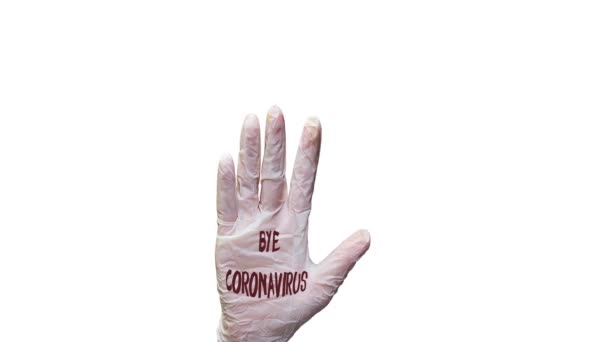 Αντίο covid-19 στο χέρι παλάμη φορώντας ιατρικά γάντια - Πλάνα, βίντεο